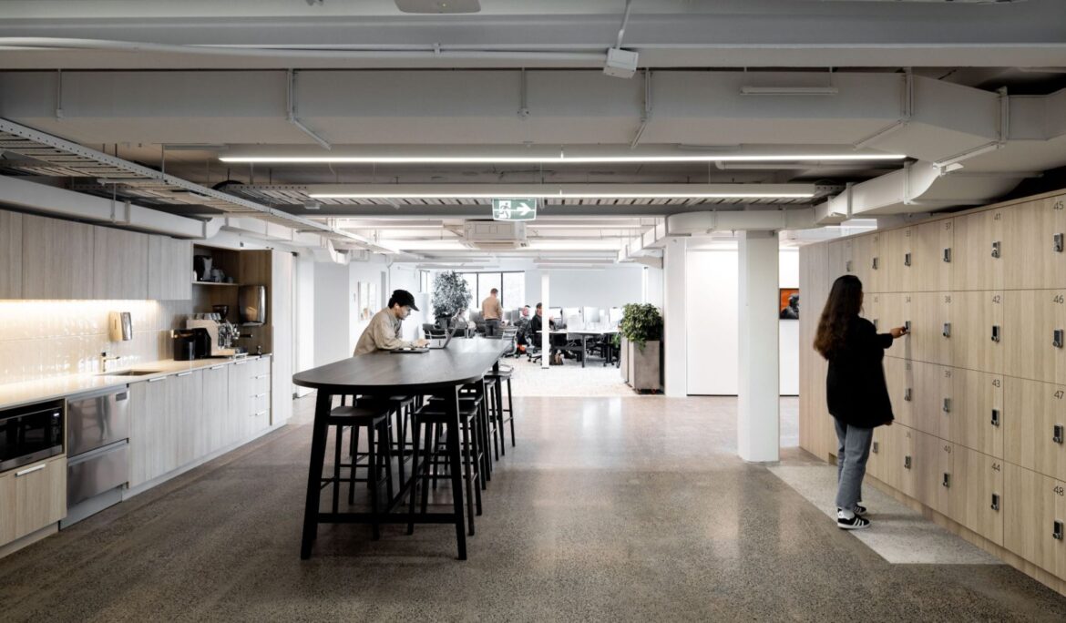 Modern open-plan office with kitchen and lockers