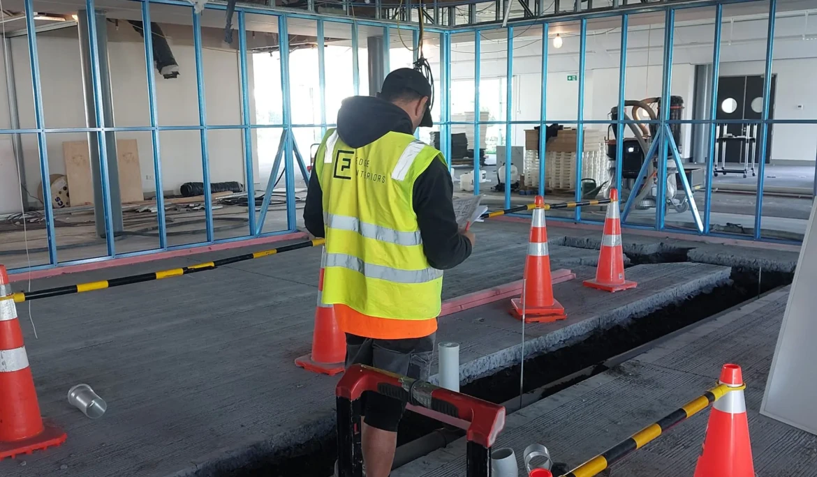 Project Manager inspecting indoor building site