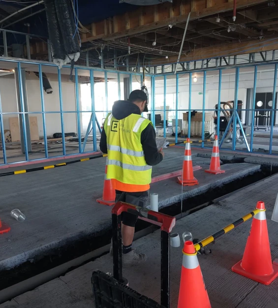 Project Manager inspecting indoor building site
