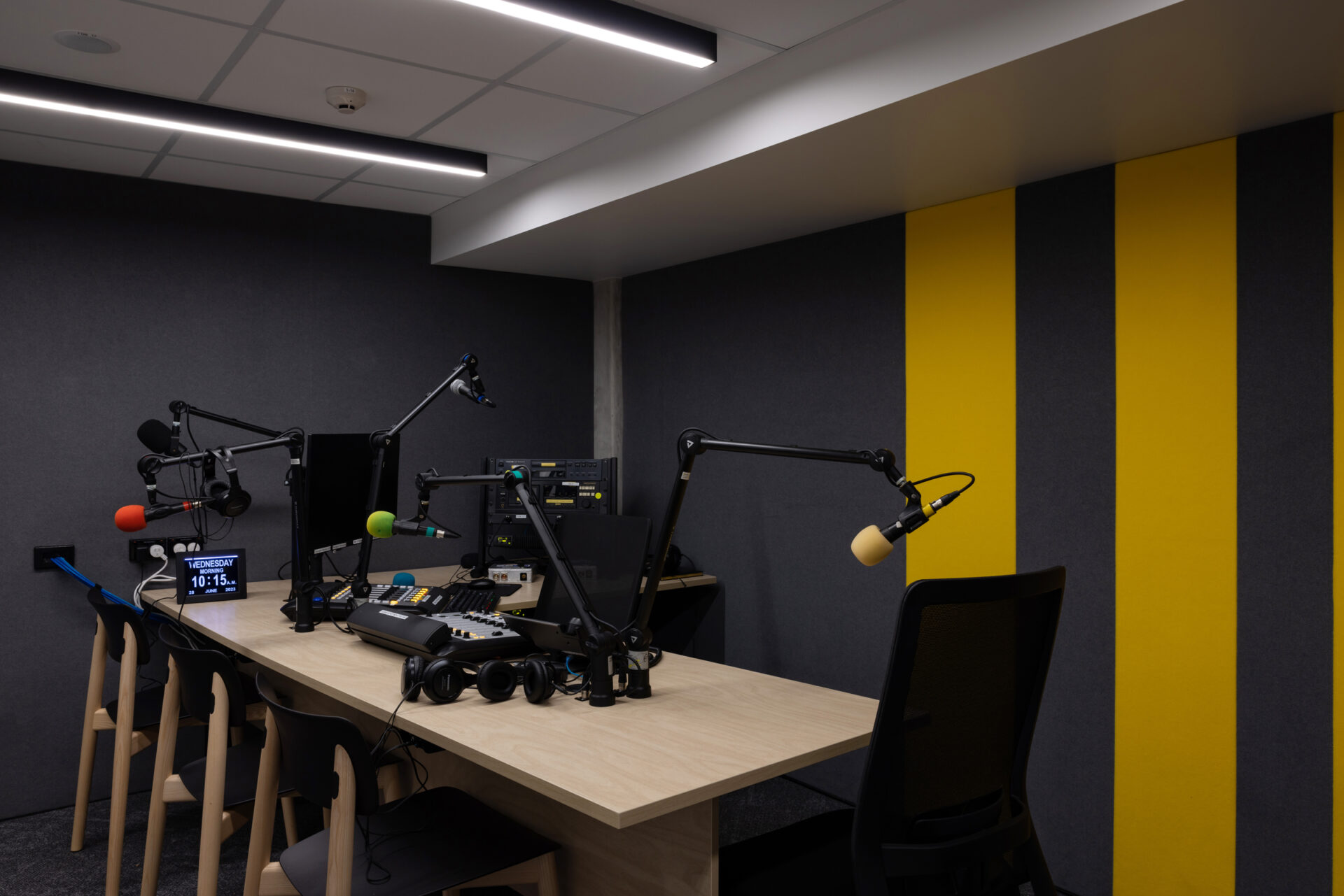 Modern podcast recording studio with microphones and equipment