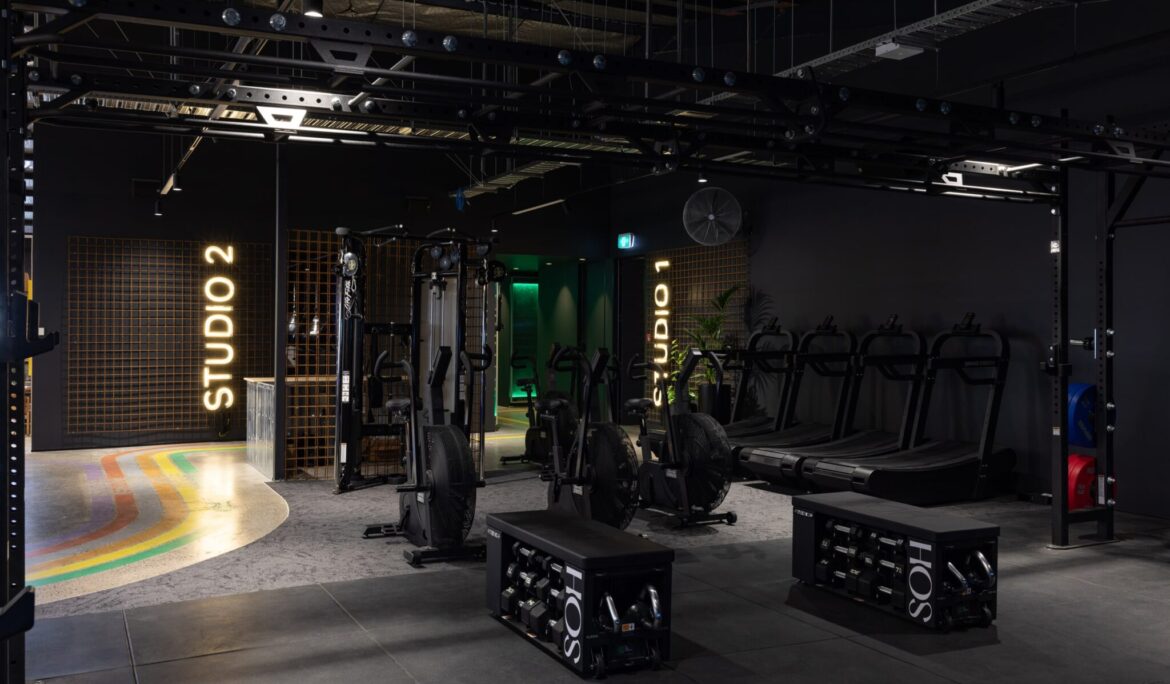 Modern gym with treadmills and weight training equipment