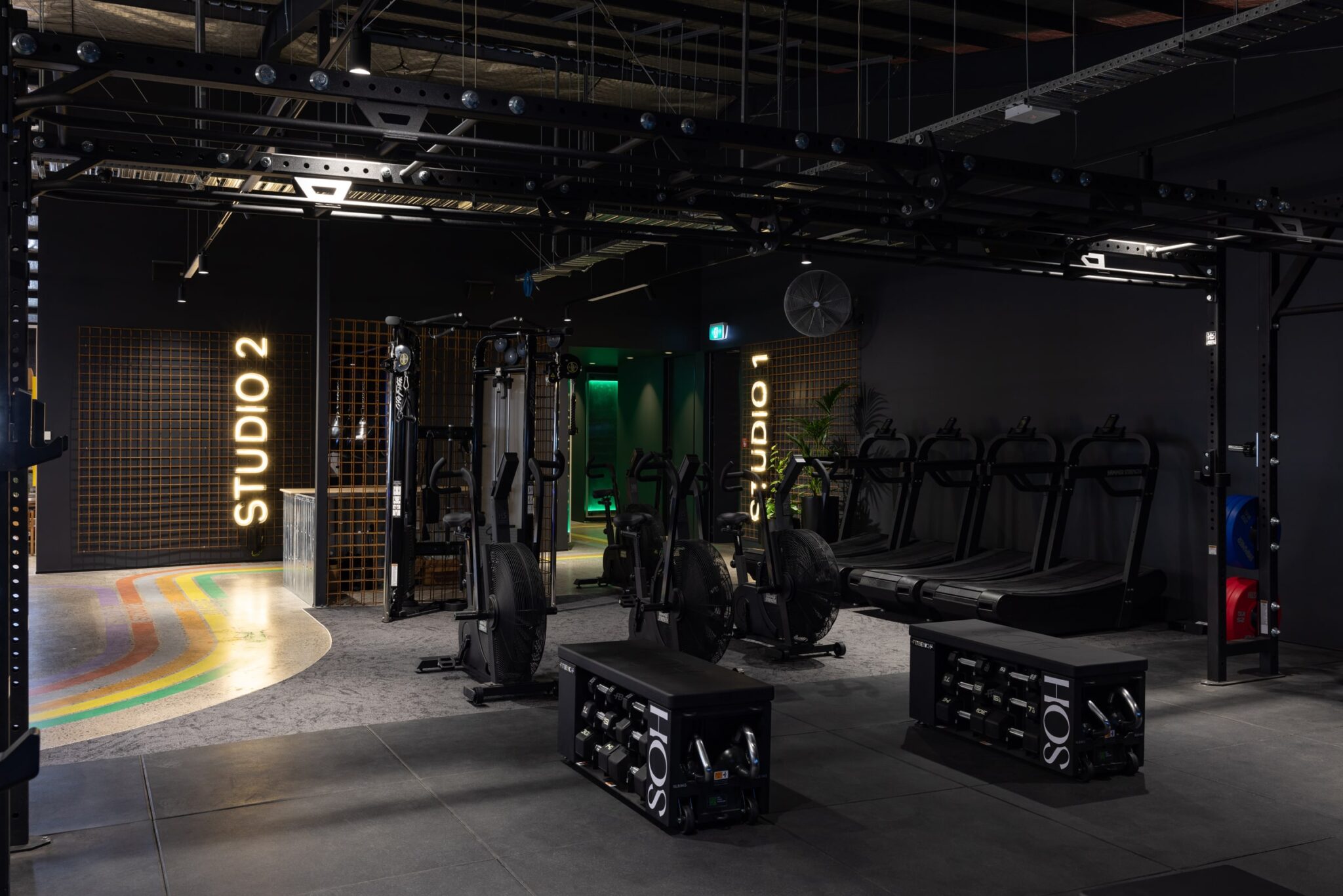 Modern gym with treadmills and weight training equipment
