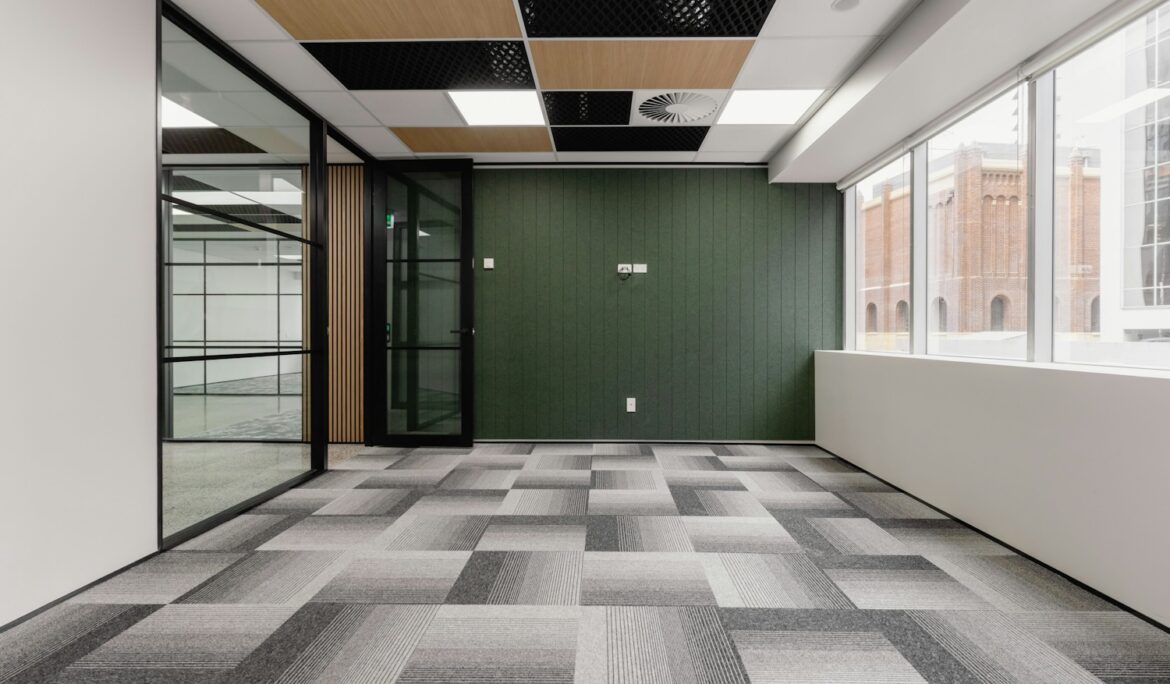 Modern empty office with glass walls and carpet