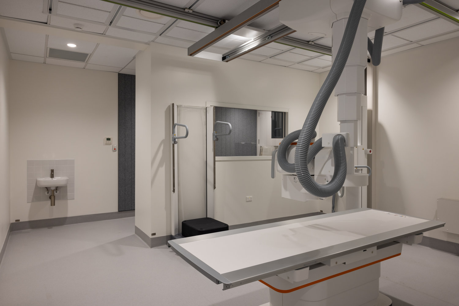 Modern hospital X-ray room with imaging equipment