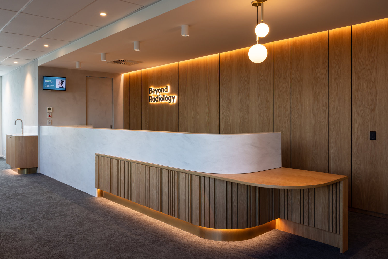 Modern radiology clinic reception with wooden design