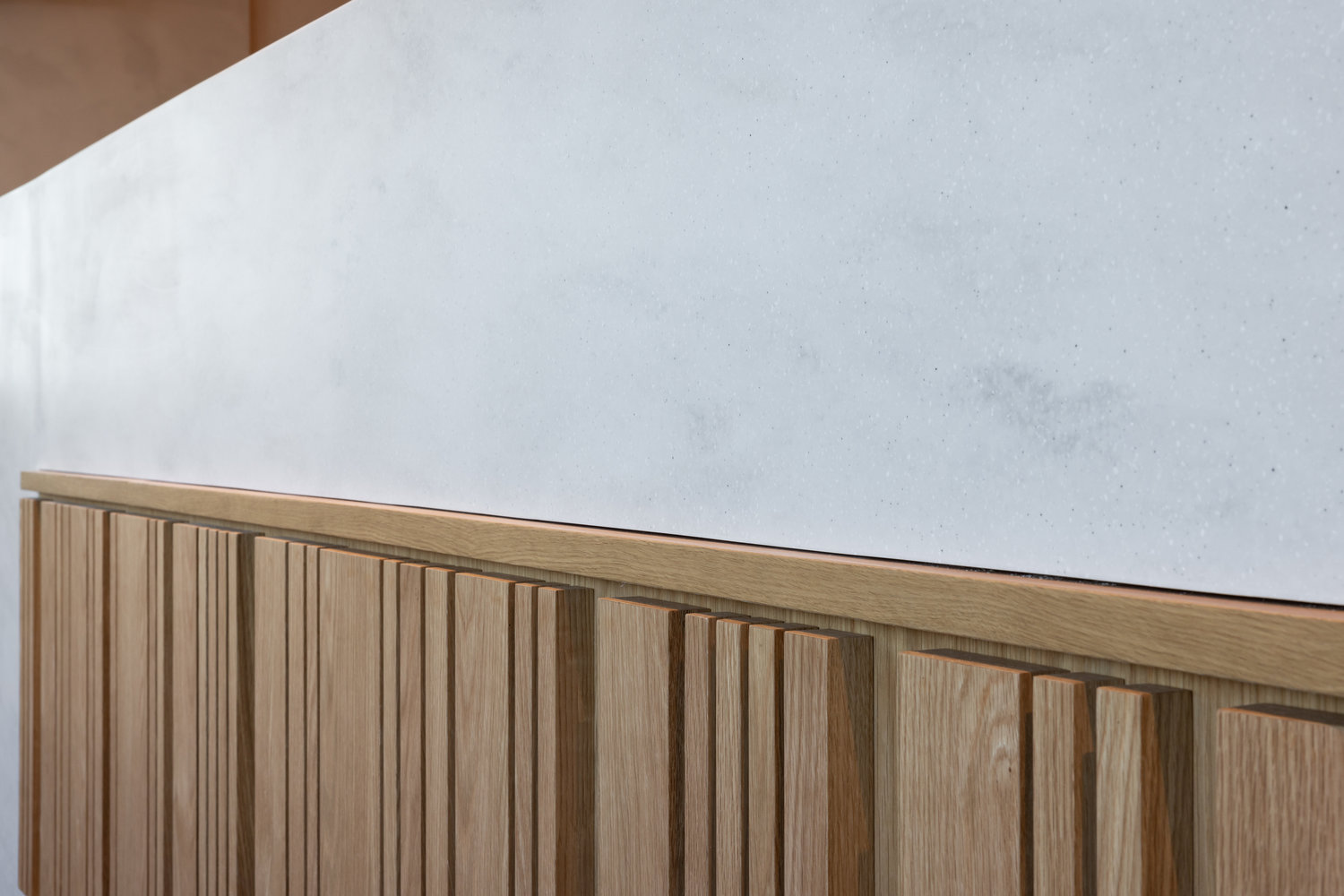 Modern wooden panel with white stone surface