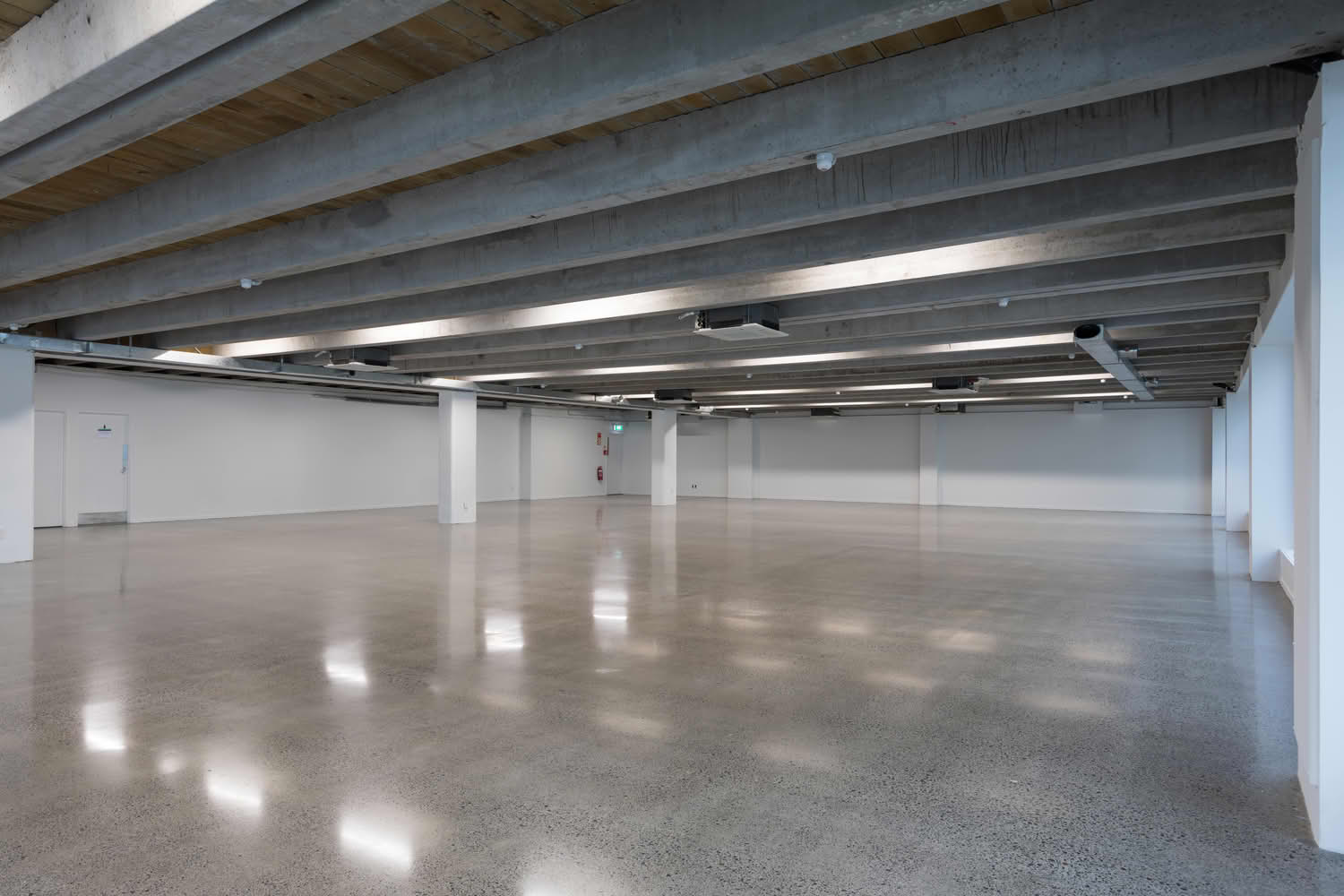 Empty industrial space with polished concrete floor