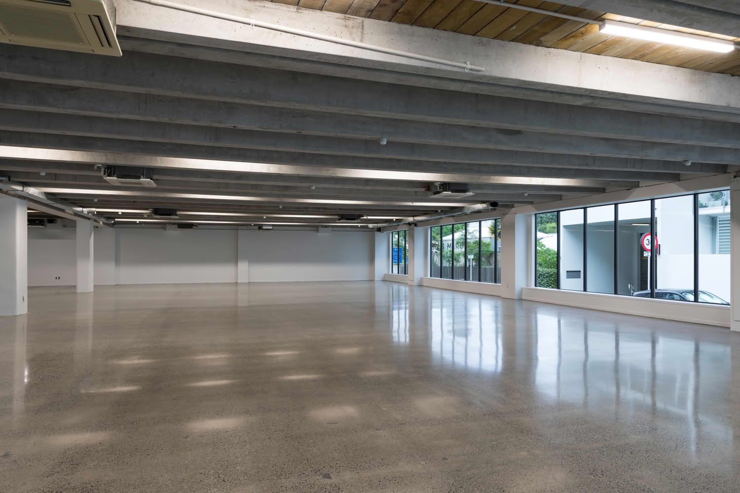 Empty modern commercial space with polished concrete floor