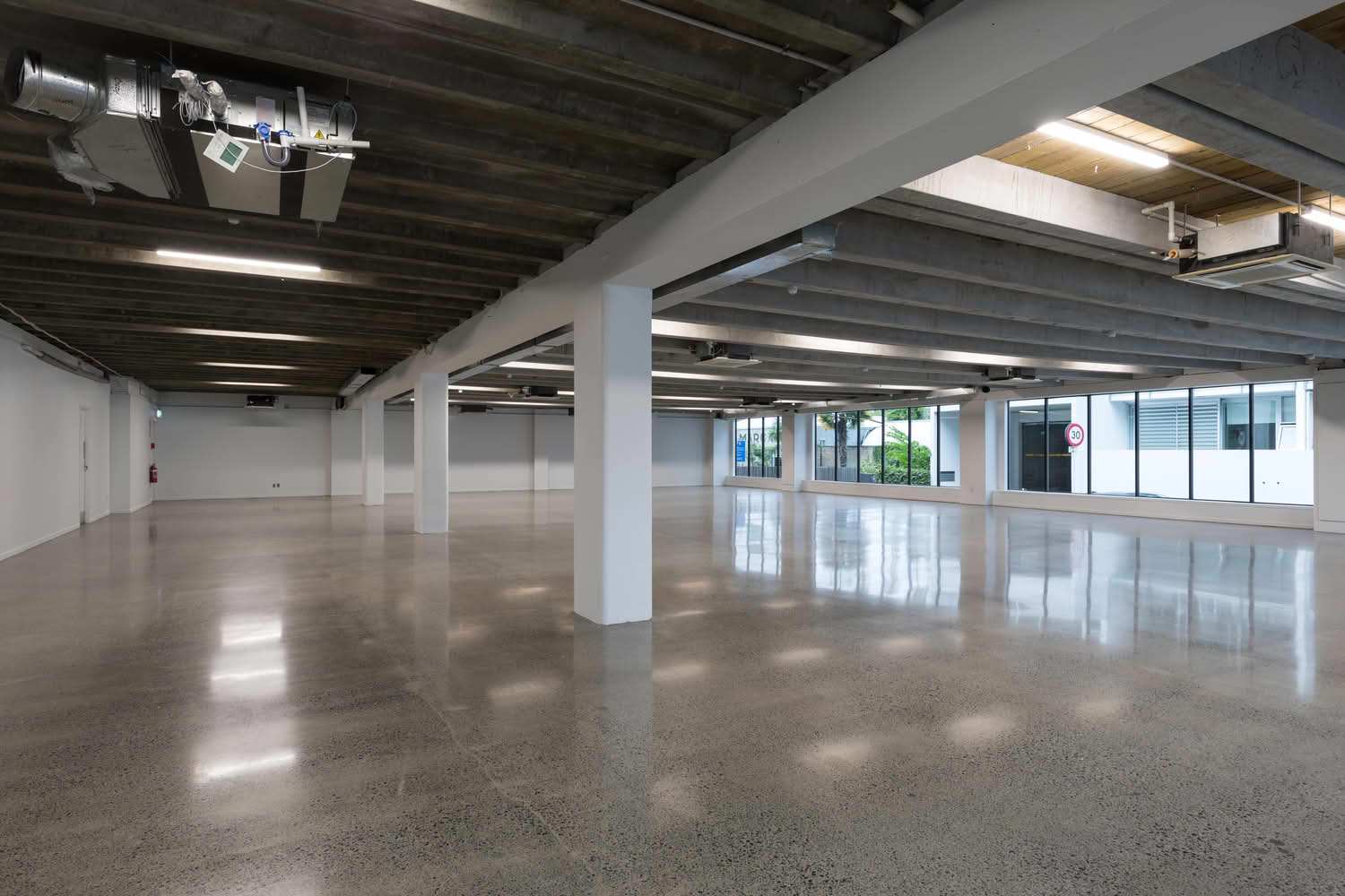 Empty modern commercial space with polished concrete floor