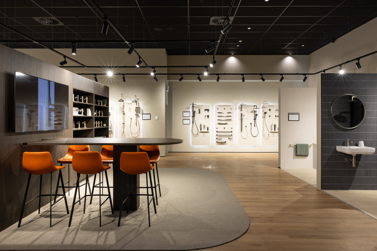 Modern showroom with bathroom fixtures and orange chairs