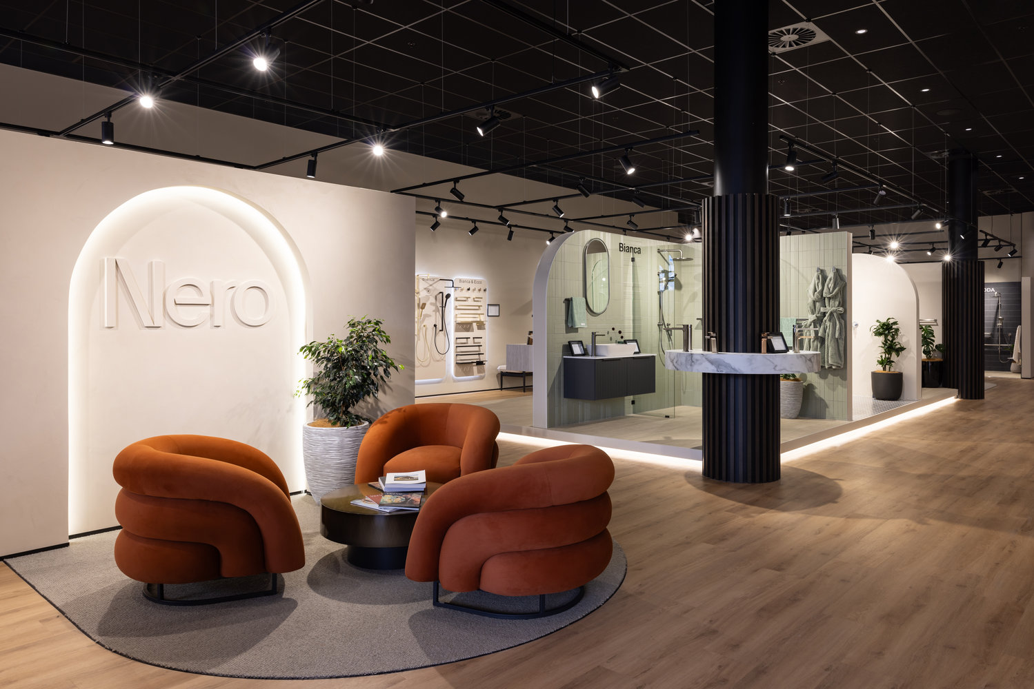 Modern showroom with orange chairs and bathroom displays