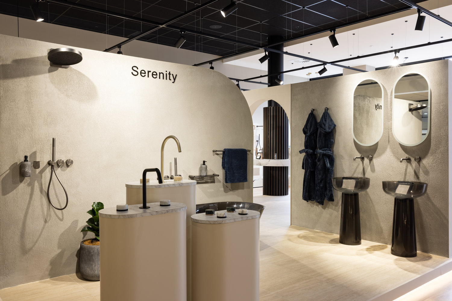 Modern bathroom showroom with sinks and shower display