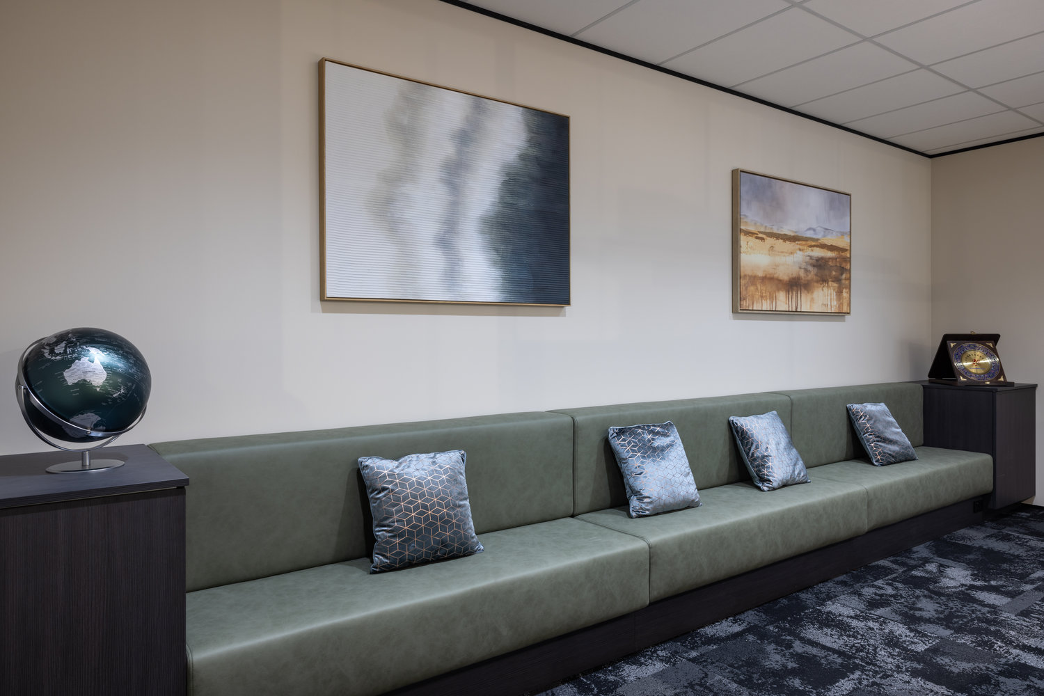 Modern waiting room with sofa and wall art