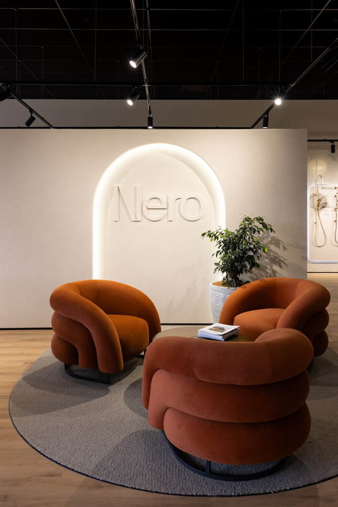 Modern lounge with orange chairs and indoor plant