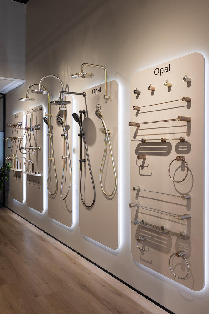 Modern bathroom fixtures and shower displays in showroom