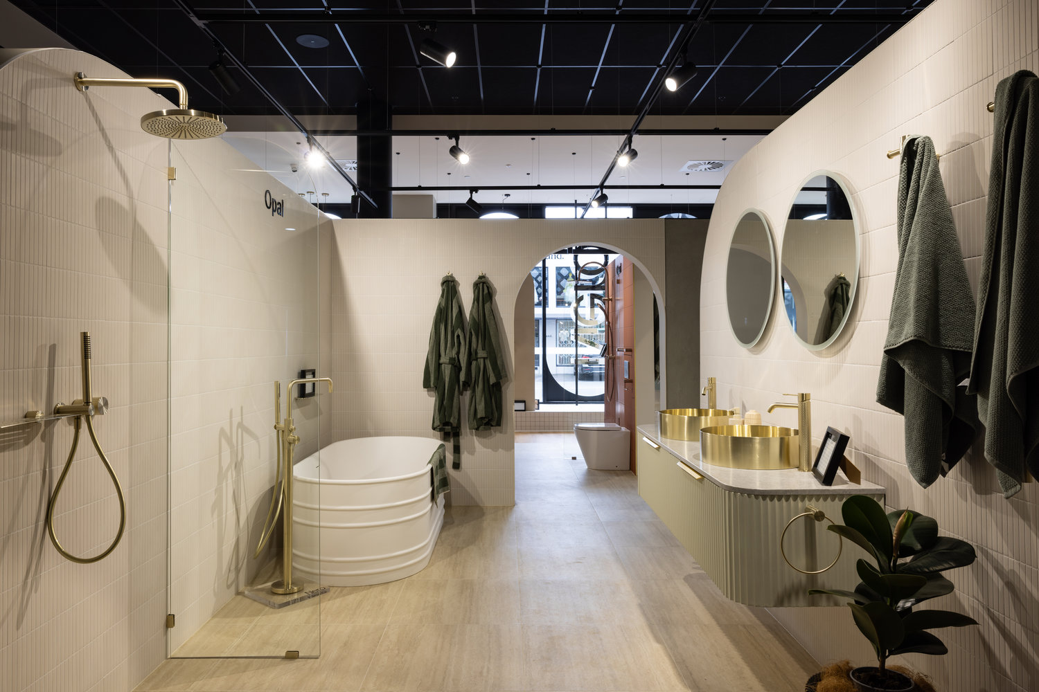 Modern bathroom with gold fixtures and freestanding tub
