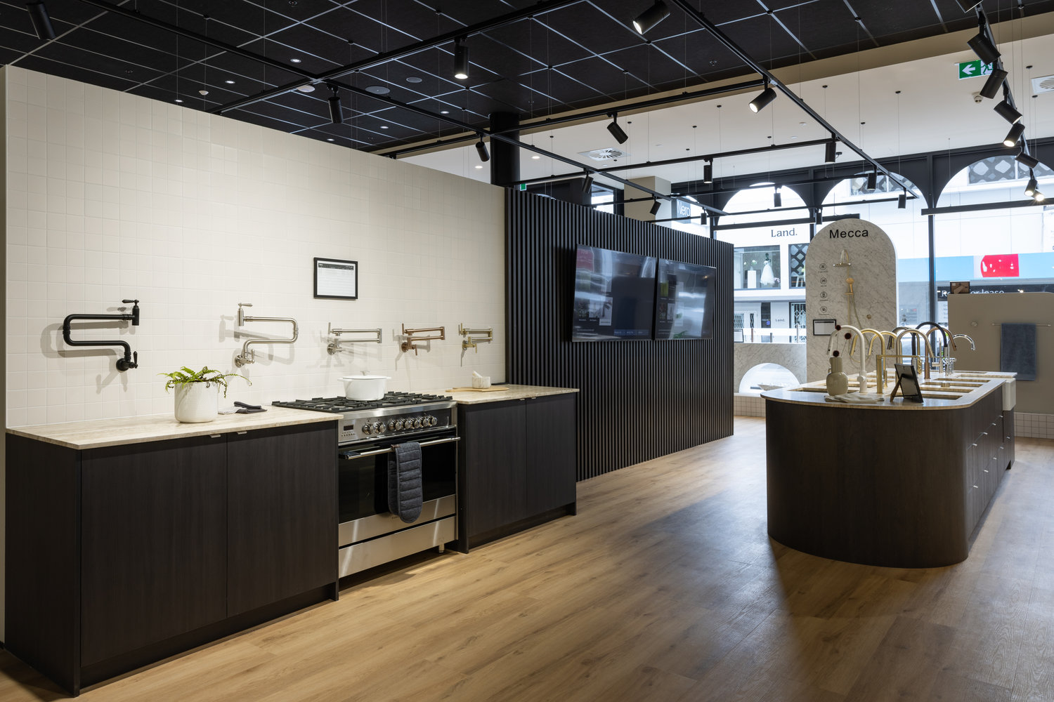 Modern kitchen showroom with sinks and faucets display