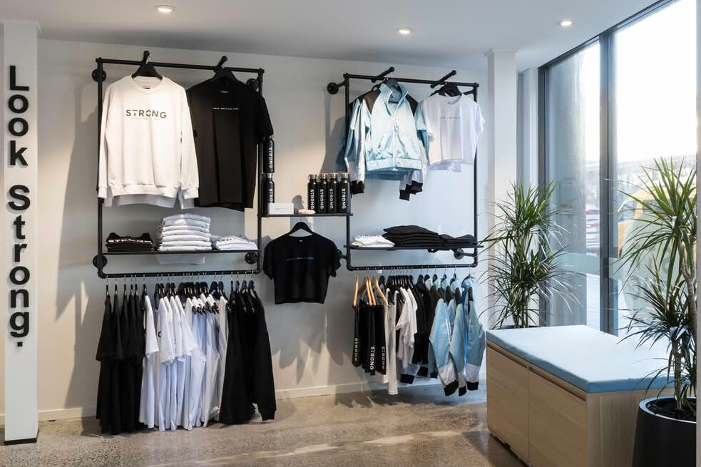 Modern clothing store displaying activewear and streetwear.