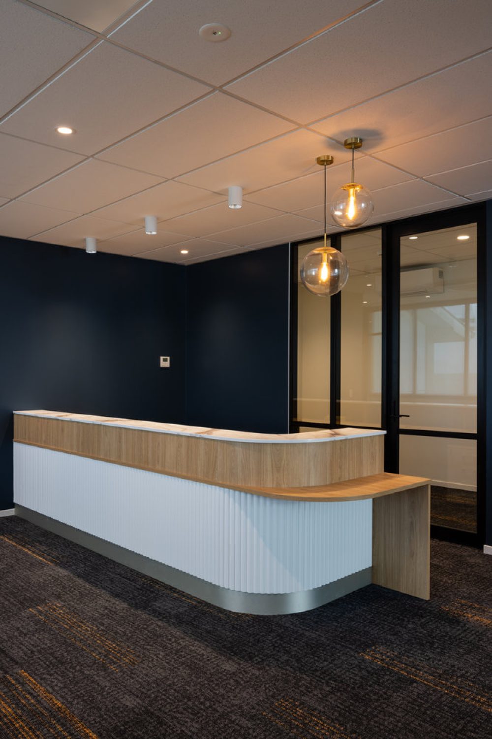 Modern office reception desk with wooden finish